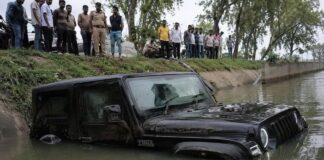 नहर में मिली THAR, अंदर थी विवाहिता की लाश, हादसा या साजिश? जांच में जुटी पुलिस Body of married woman found in Thar vehicle in Greater Noida canal; husband claims accident, brother